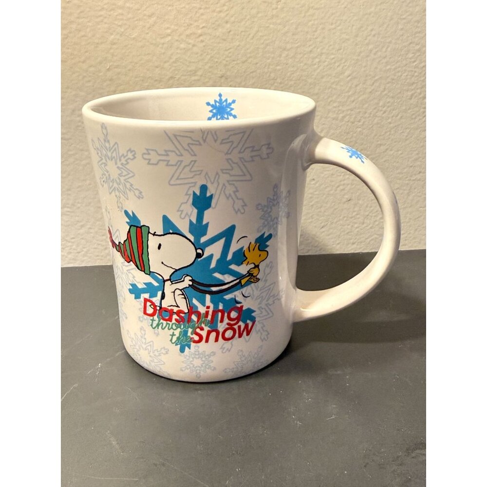 Peanuts Snoopy Dashing Through The Snow Ceramic Mug 16 oz Holiday Snowflake